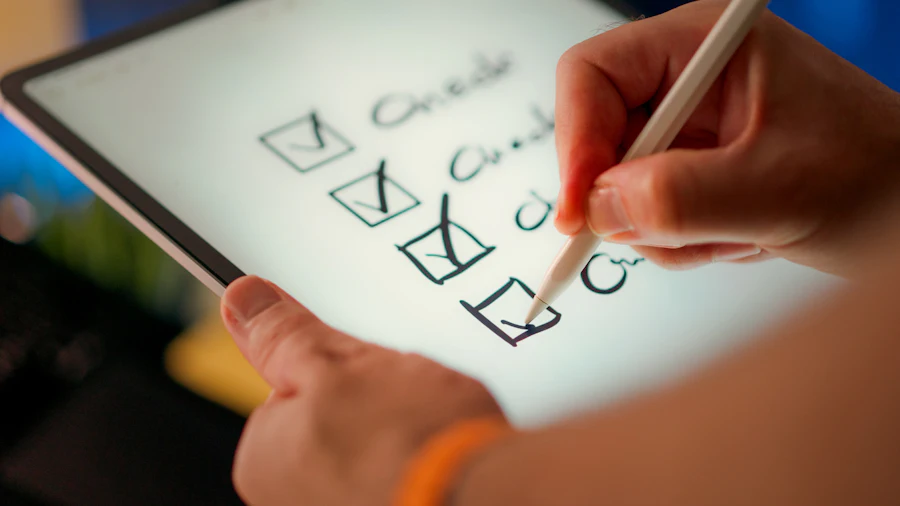 Hand ticking boxes on a checklist with a pencil