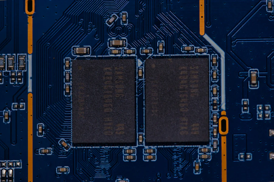 Close view of a blue circuit board with two memory chips