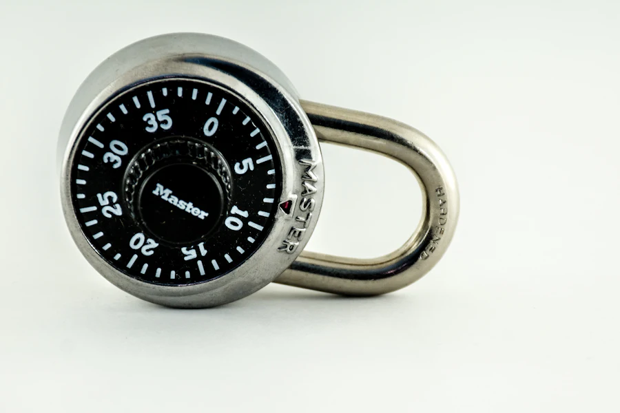 Black and silver combination padlock on a white surface
